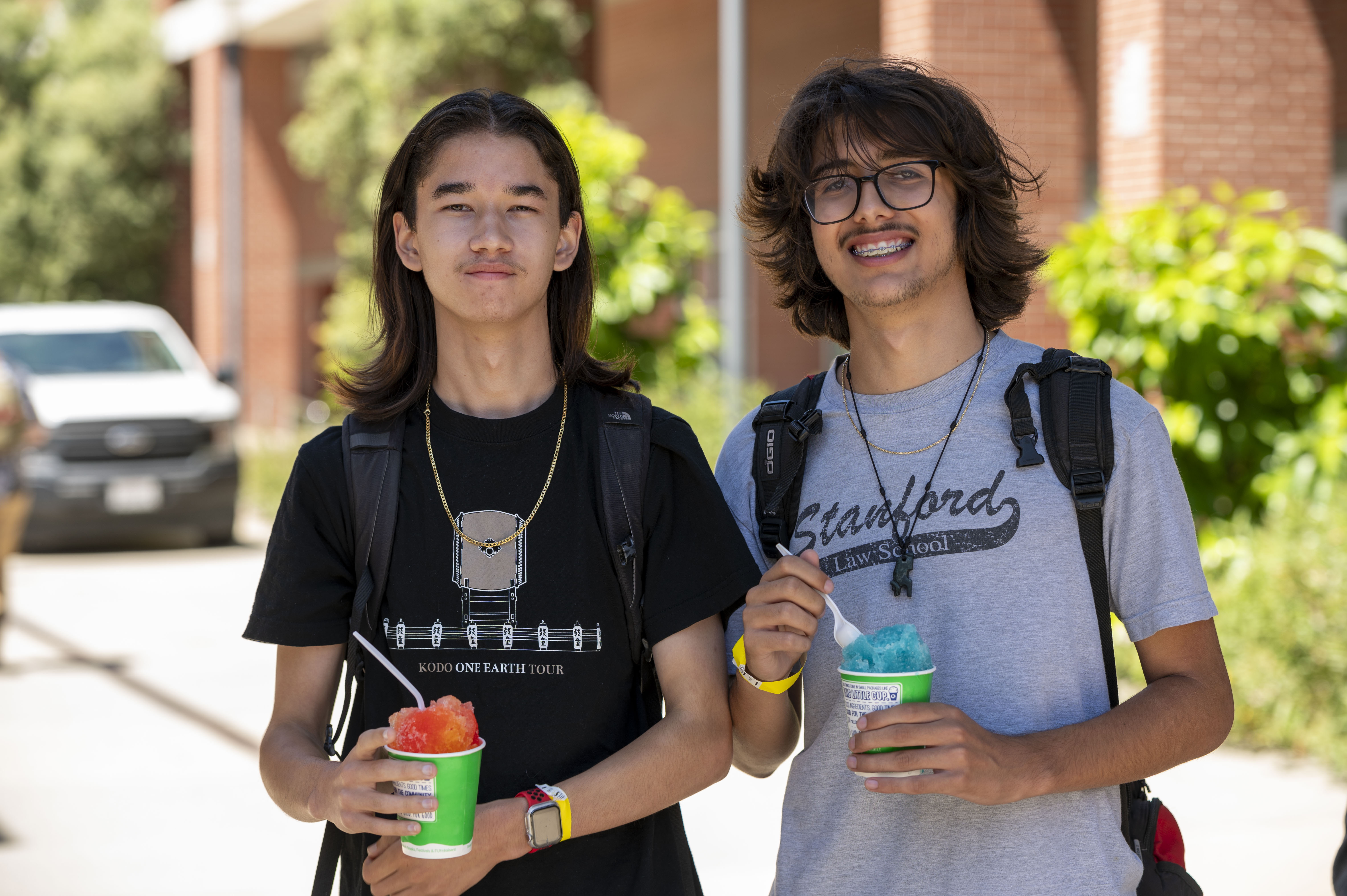 Two students smiling outside