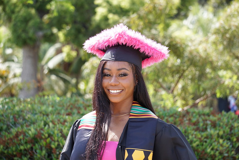 Woman in pink graduation cap