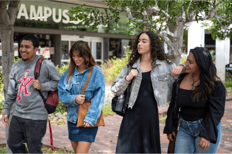 Students walking by a college bookstore