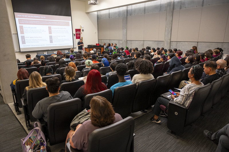 presentation in front of students in an auditorium
