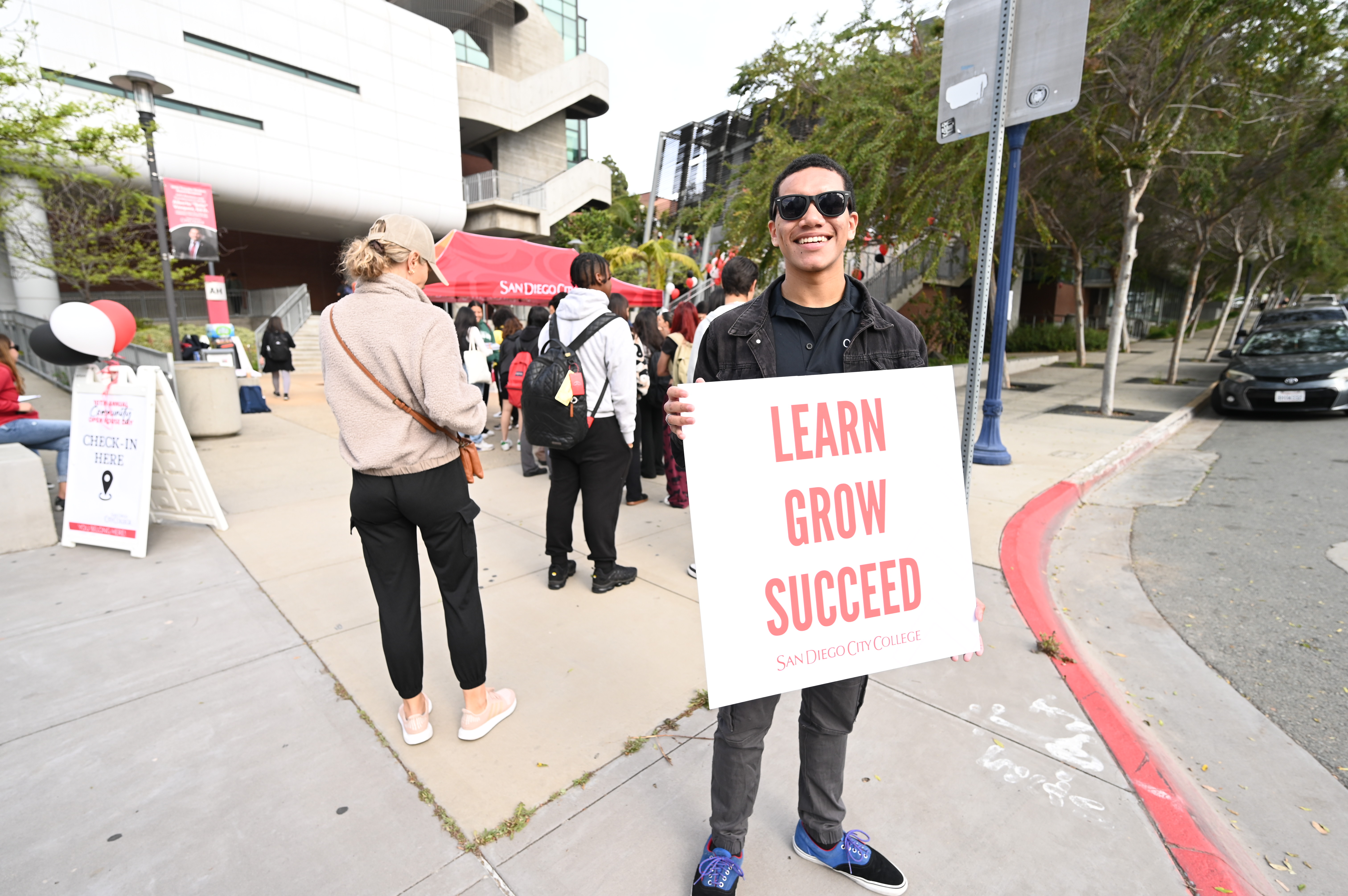 student with sign