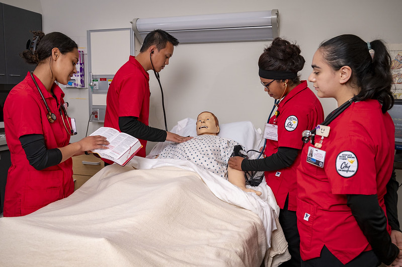 Nursing students with mannequin