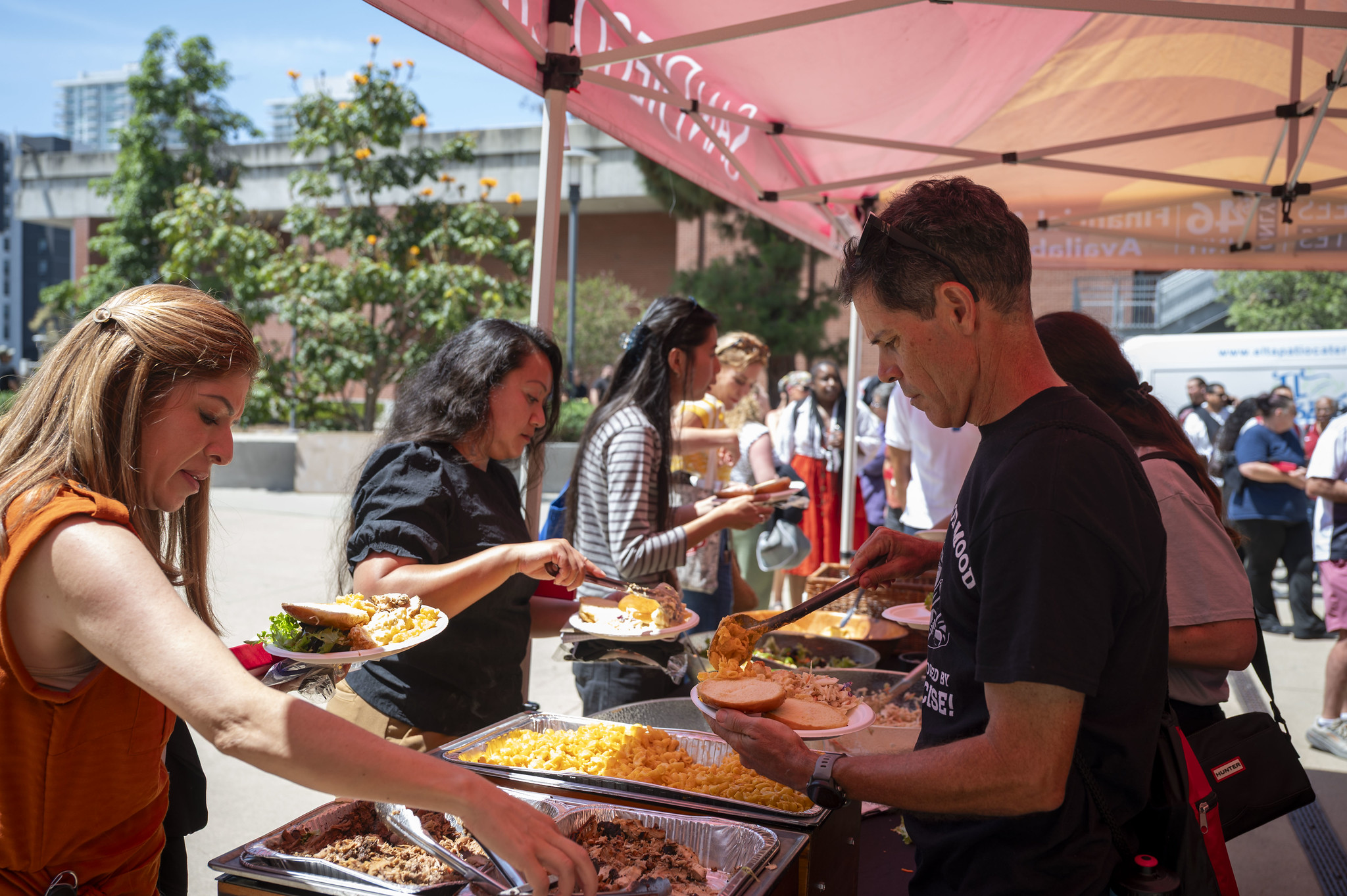 people serving themselves lunch
