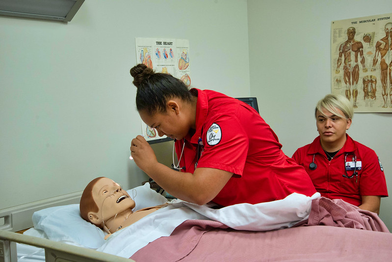 Nursing students with mannequin
